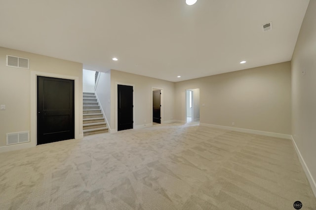 unfurnished room featuring visible vents, stairway, baseboards, and recessed lighting