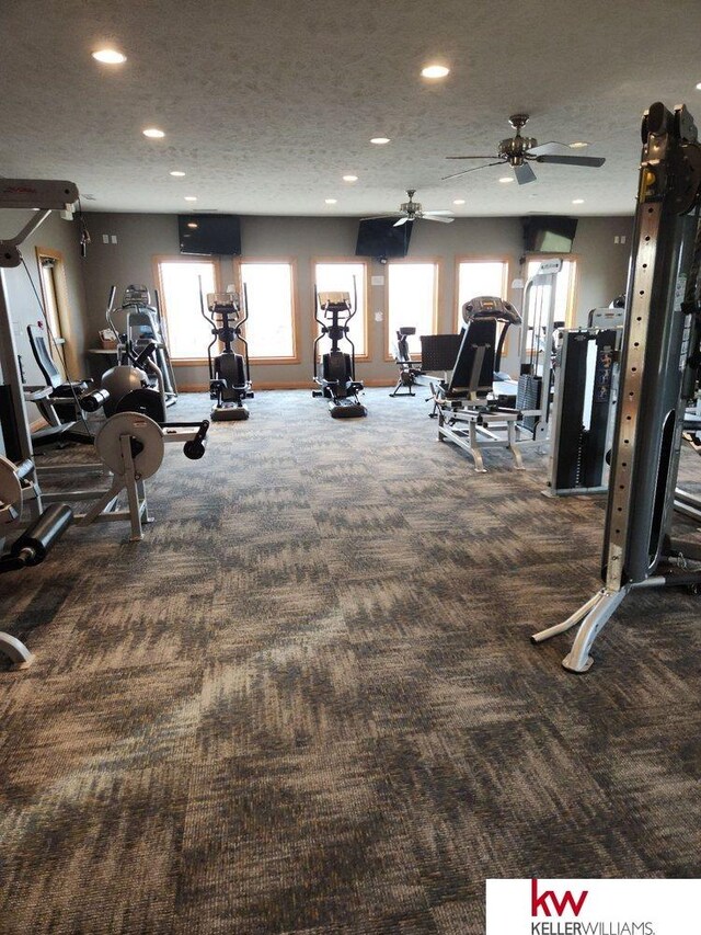 workout area with recessed lighting, carpet flooring, and a textured ceiling