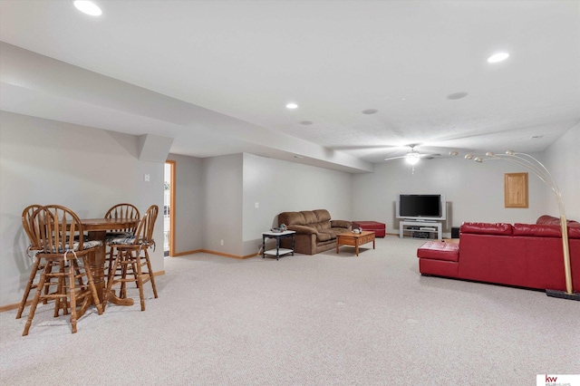 living room featuring carpet, baseboards, a ceiling fan, and recessed lighting