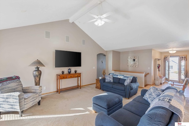 living room featuring baseboards, visible vents, arched walkways, light colored carpet, and beam ceiling