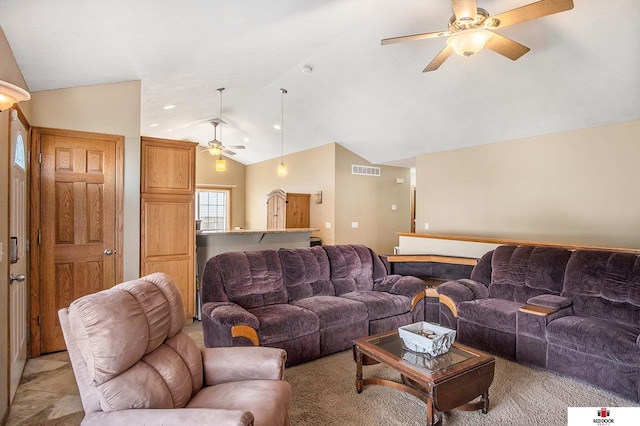 living area with ceiling fan, visible vents, and vaulted ceiling