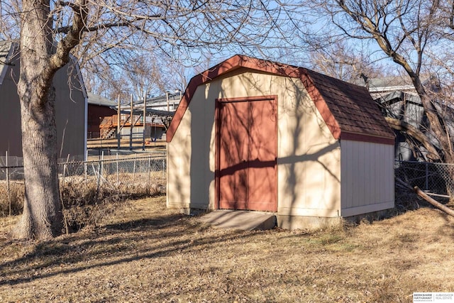 view of shed with fence