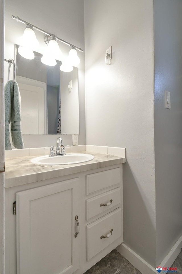 bathroom featuring vanity and baseboards