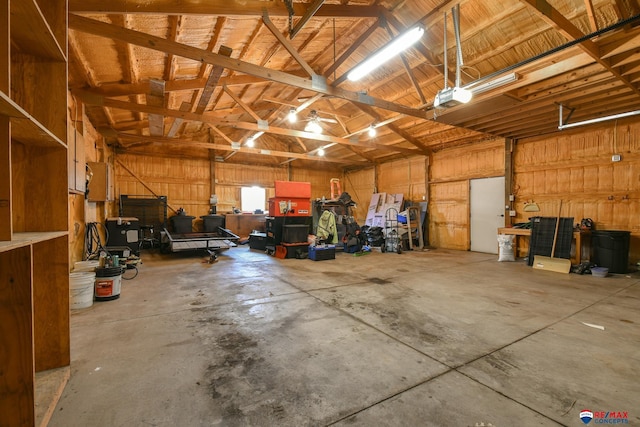 garage with a garage door opener and metal wall