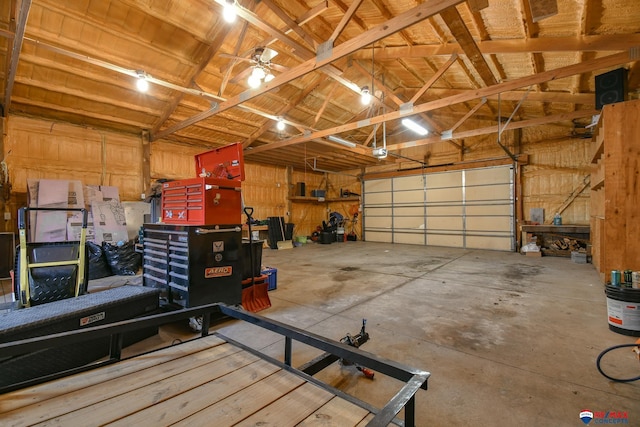 garage with a garage door opener and ceiling fan