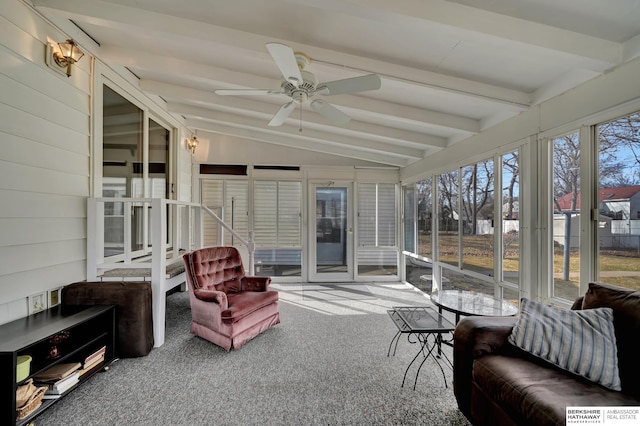 sunroom / solarium with lofted ceiling with beams and a ceiling fan