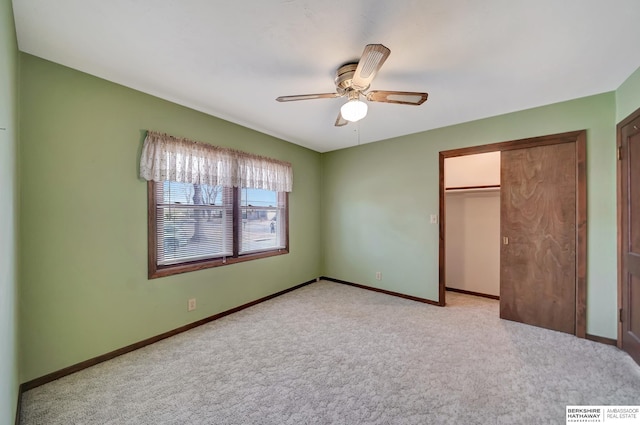 unfurnished bedroom with baseboards, light carpet, a closet, and a ceiling fan