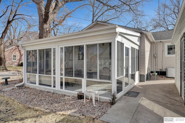 view of side of property featuring a sunroom