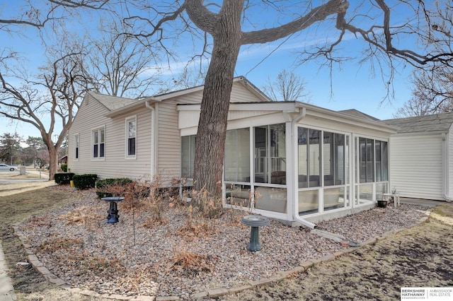 view of home's exterior featuring a sunroom