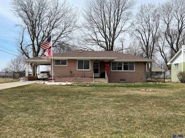 view of front facade featuring a carport, brick siding, a front yard, and driveway