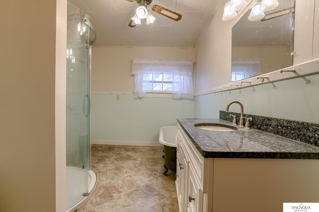 full bath featuring baseboards, toilet, ceiling fan, vanity, and a shower stall