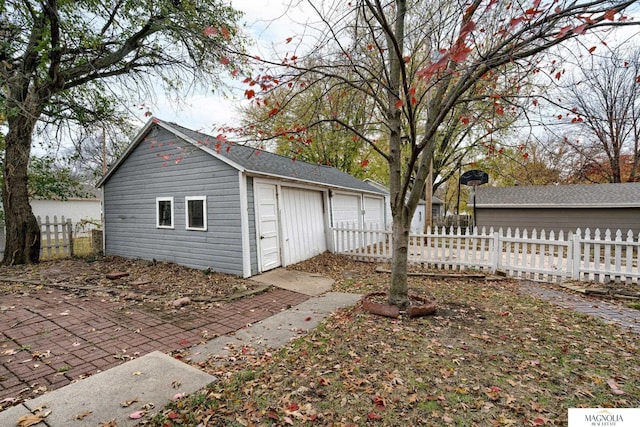 garage featuring fence