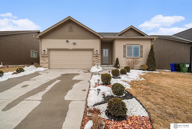 ranch-style home with a garage, stone siding, and driveway