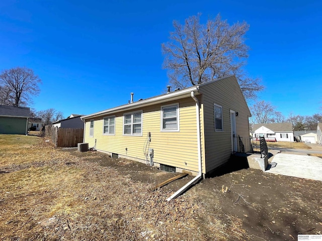 rear view of house with fence