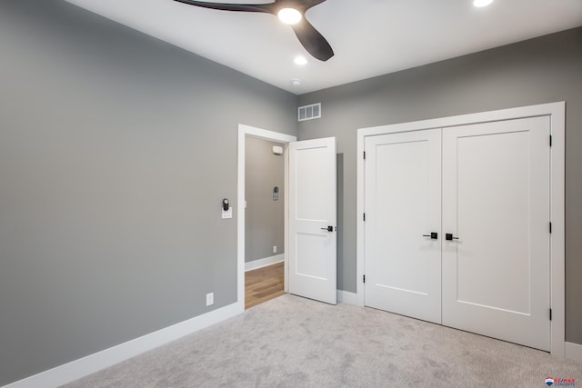 unfurnished bedroom featuring visible vents, a ceiling fan, a closet, carpet flooring, and baseboards