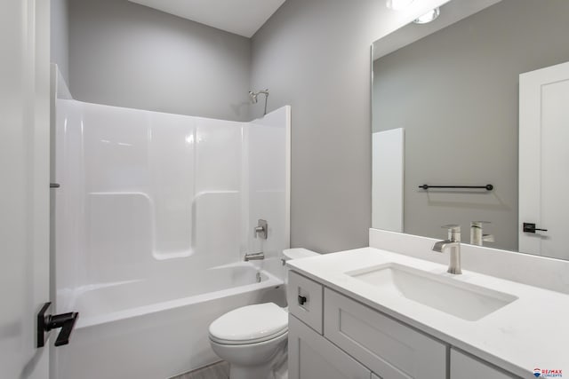 bathroom with toilet, vanity, and shower / bathing tub combination