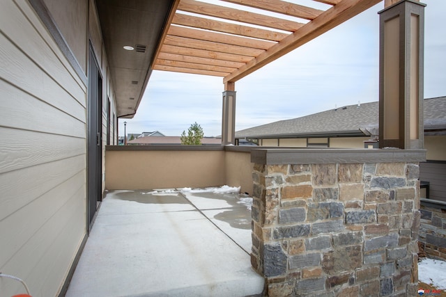 view of patio / terrace with a balcony and a pergola