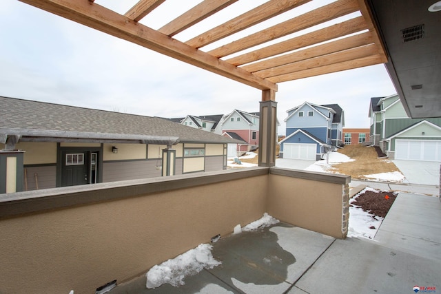 view of patio with a balcony, a pergola, and a residential view