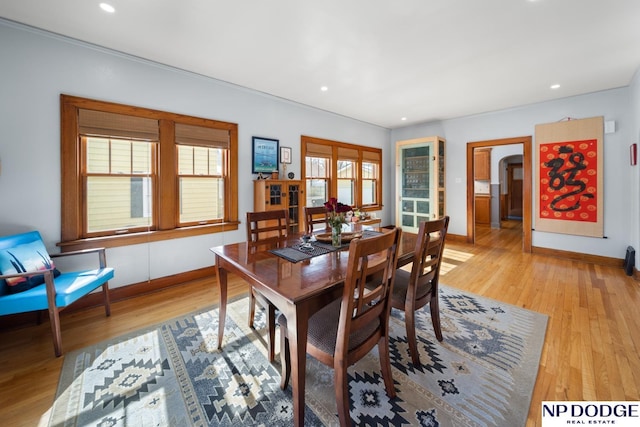 dining room with light wood-style flooring, recessed lighting, and baseboards