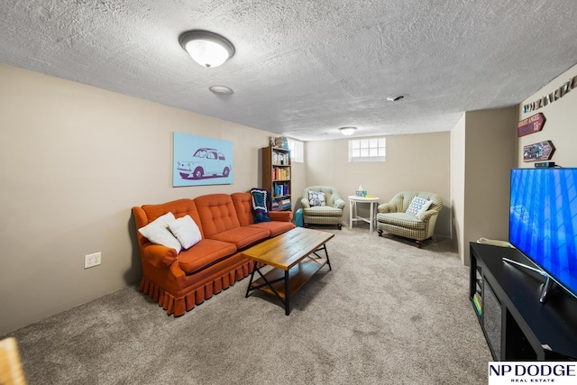 living area with a textured ceiling and carpet floors