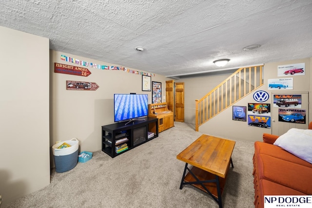 living area with stairs, carpet, and a textured ceiling