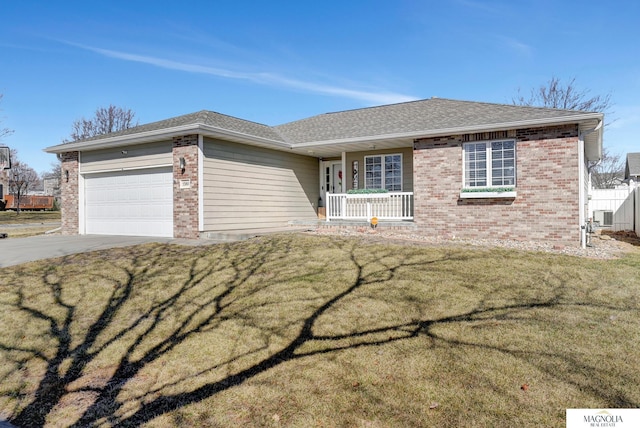 single story home with driveway, a porch, a front yard, a garage, and brick siding