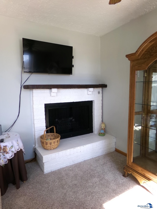 room details with carpet flooring, a brick fireplace, a textured ceiling, and baseboards