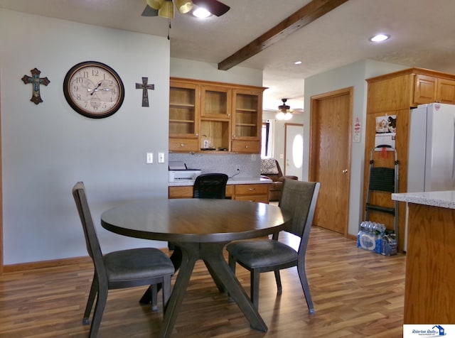 dining room with beam ceiling, recessed lighting, a ceiling fan, and wood finished floors