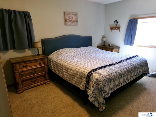 bedroom with light colored carpet