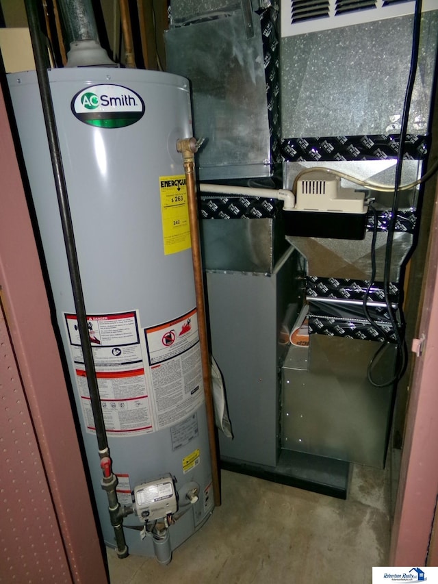 utility room featuring heating unit and water heater