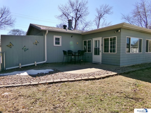 back of house with a patio