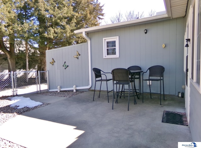 view of patio featuring a gate and fence