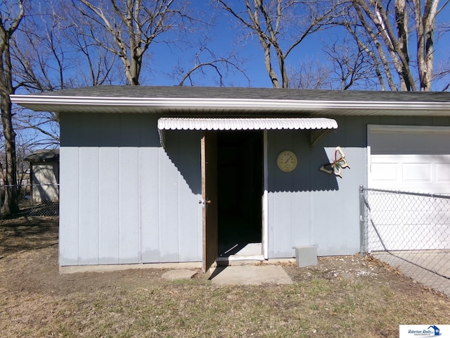 garage with fence