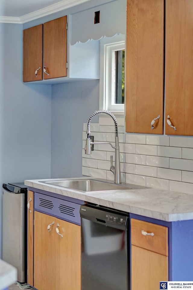 kitchen featuring a sink, light countertops, dishwasher, crown molding, and backsplash