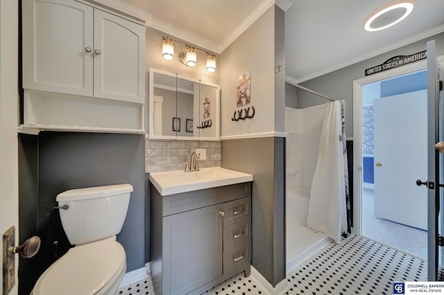 bathroom featuring vanity, crown molding, toilet, and a shower stall