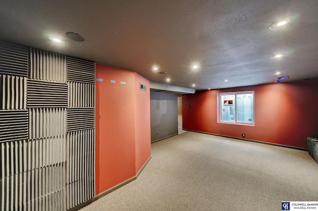 corridor with visible vents, recessed lighting, carpet, and baseboards