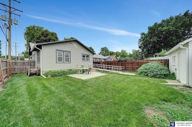 view of yard with a patio area and a fenced backyard