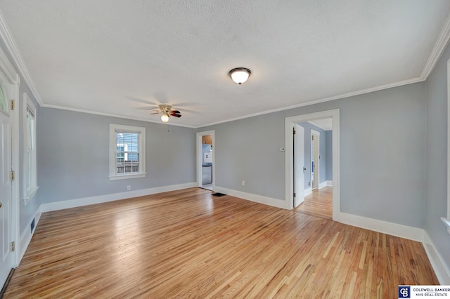 unfurnished room with light wood finished floors, baseboards, ornamental molding, a textured ceiling, and a ceiling fan