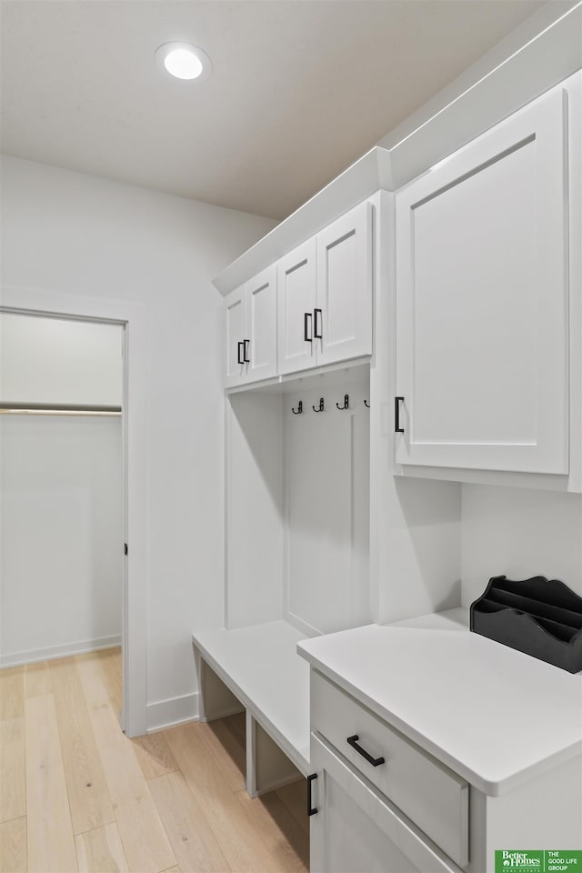 mudroom featuring light wood-style floors and recessed lighting