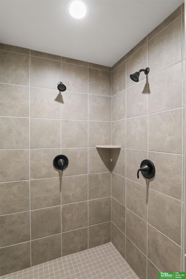 full bathroom with a tile shower