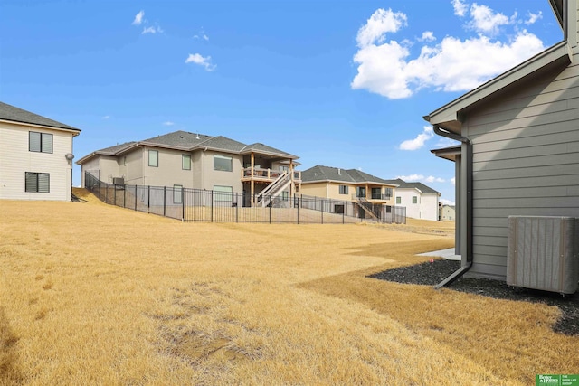 view of yard featuring a residential view and fence