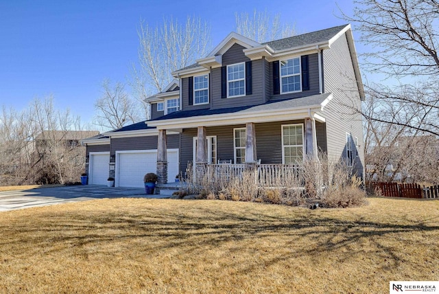 view of front of property featuring covered porch, concrete driveway, a front lawn, and a garage