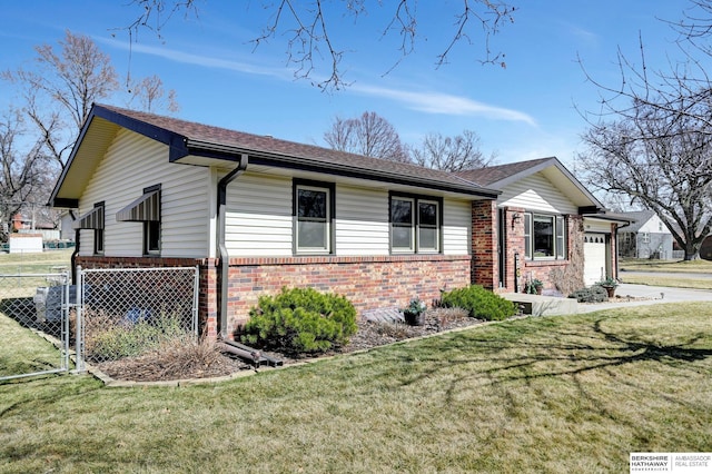 view of front of home with a front lawn, a garage, fence, and brick siding