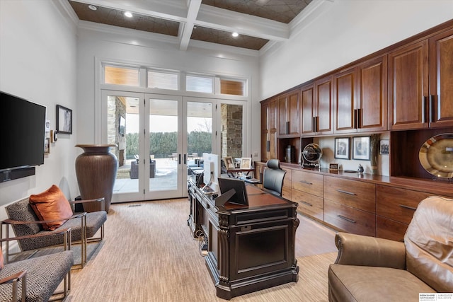 office area featuring beam ceiling, ornamental molding, coffered ceiling, french doors, and a towering ceiling