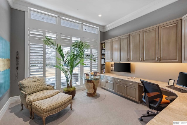 home office featuring ornamental molding, recessed lighting, baseboards, light colored carpet, and built in study area