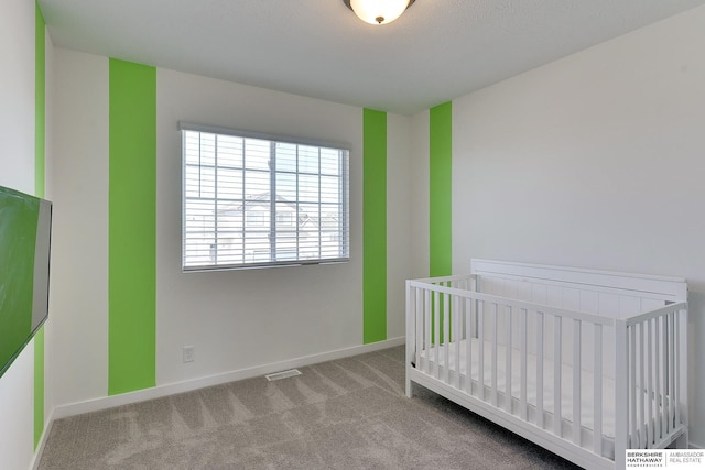 bedroom with visible vents, baseboards, and carpet floors