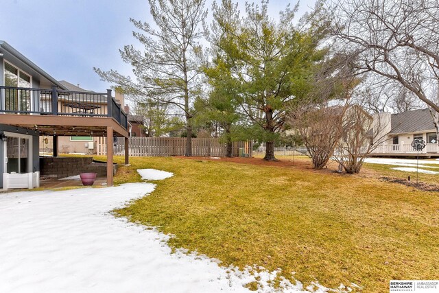 view of yard featuring a deck and fence