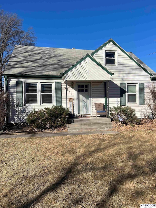 view of front of home with roof with shingles