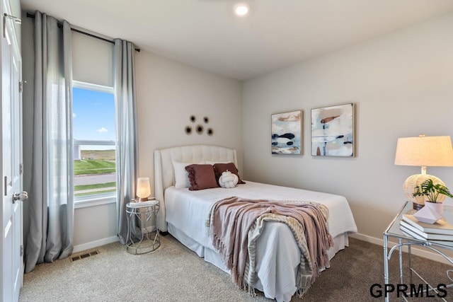 bedroom with visible vents, baseboards, and carpet flooring