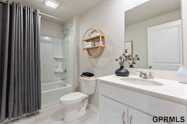 full bathroom featuring vanity, shower / tub combo, and toilet